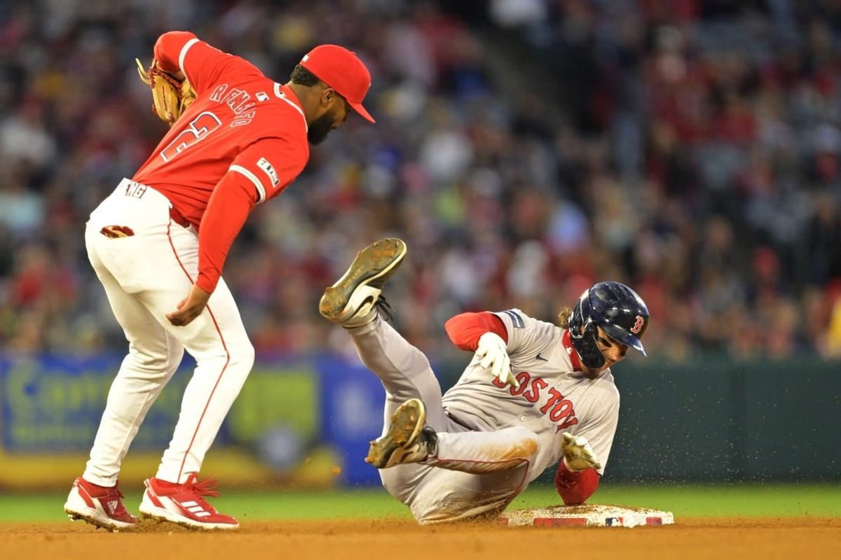 Apr 6, 2024; Anaheim, California, USA; Boston Red Sox outfielder Jarren Duran (16) is tagged out by Los Angeles Angels third base Luis Rengifo (2) on an attempted stolen base in the third inning at Angel Stadium.