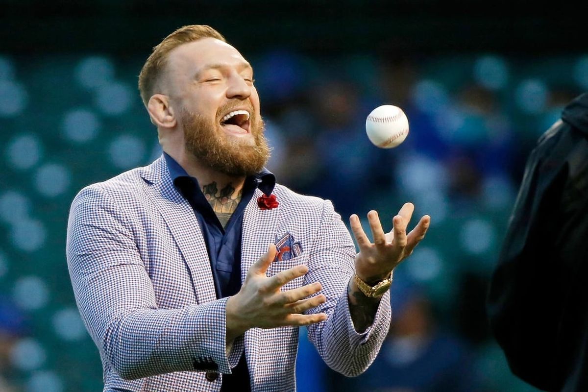 Sep 21, 2021; Chicago, Illinois, USA; MMA fighter Conor McGregor tosses the ball after throwing out a ceremonial first pitch before the game between the Chicago Cubs and the Minnesota Twins at Wrigley Field.