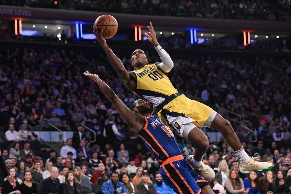 Feb 10, 2024; New York, New York, USA; Indiana Pacers guard Bennedict Mathurin (00) shoots the ball while being defended by New York Knicks guard Alec Burks (18) during the second quarter at Madison Square Garden.