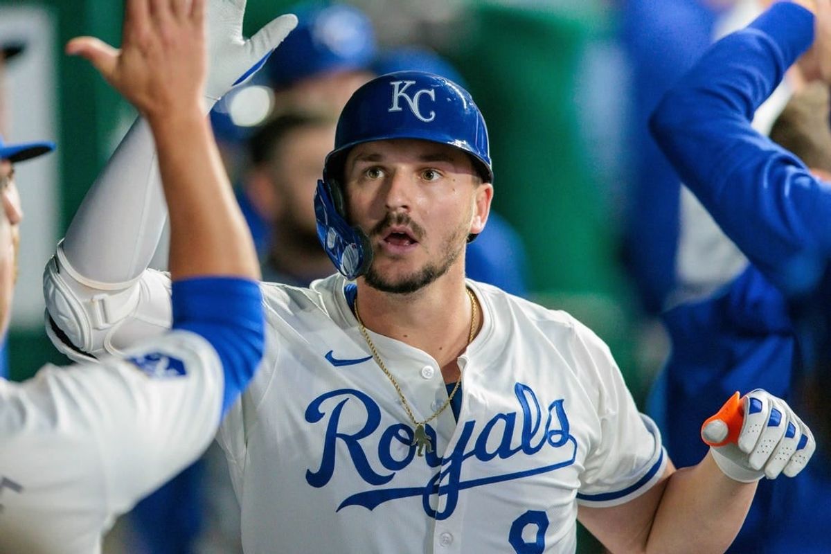 Apr 10, 2024; Kansas City, Missouri, USA; Kansas City Royals first base Vinnie Pasquantino (9) celebrates in the dugout during the fourth inning after hitting a home run against the Houston Astros at Kauffman Stadium.