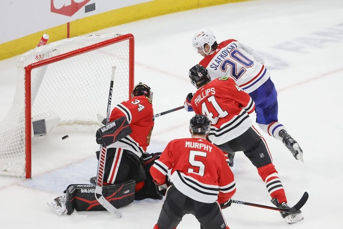 Dec 22, 2023; Chicago, Illinois, USA; Montreal Canadiens left wing Juraj Slafkovsky (20) shoots and scores against Chicago Blackhawks goaltender Petr Mrazek (34) during the second period at United Center.