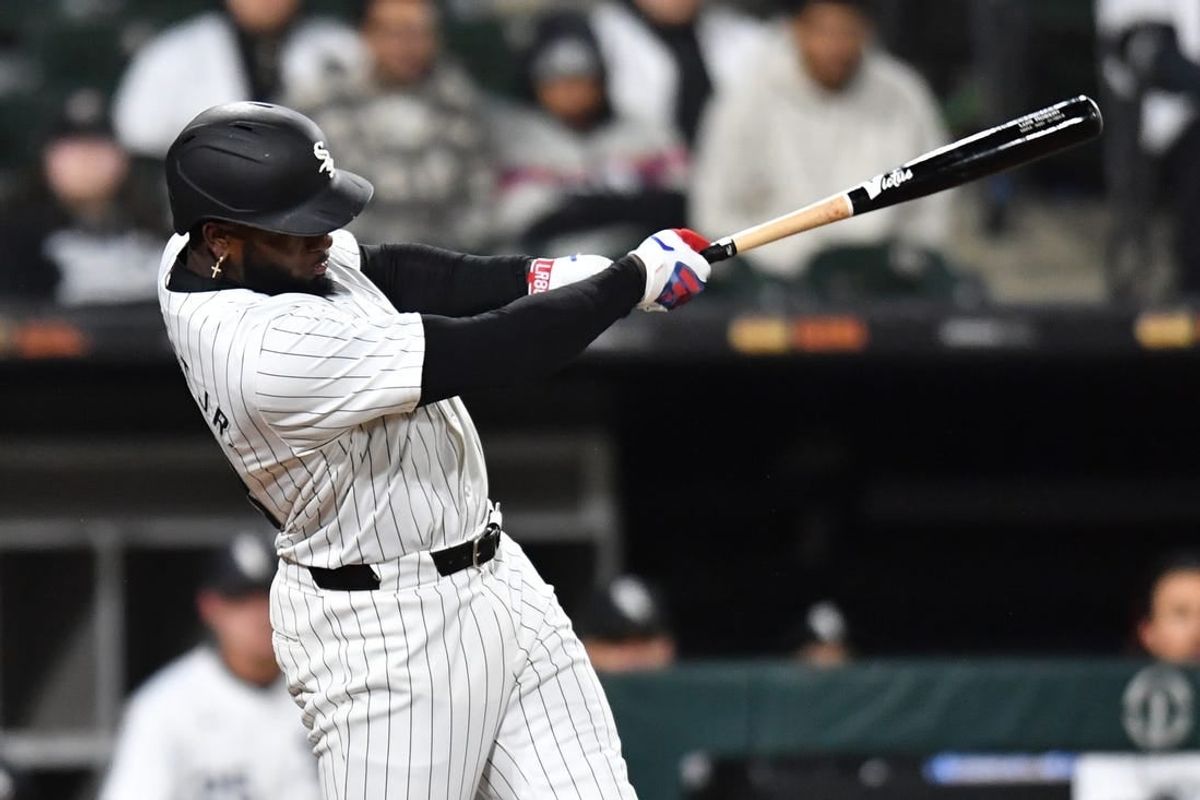 Apr 2, 2024; Chicago, Illinois, USA; Chicago White Sox center fielder Luis Robert Jr. (88) doubles during the eighth inning againnst the Atlanta Braves at Guaranteed Rate Field.