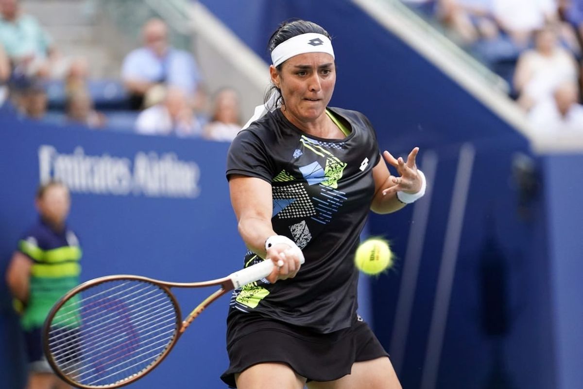 Sep 4, 2023; Flushing, NY, USA; Ons Jabeur of Tunisia hits to Qinwen Zheng of China on day eight of the 2023 U.S. Open tennis tournament at USTA Billie Jean King National Tennis Center.
