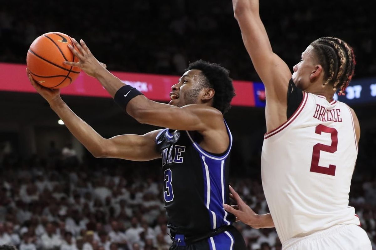 Nov 29, 2023; Fayetteville, Arkansas, USA; Duke Blue Devils guard Jeremy Roach (3) drives to the during the first half as Arkansas Razorbacks forward Trevon Brazile (2) defends at Bud Walton Arena. Arkansas won 80-75.