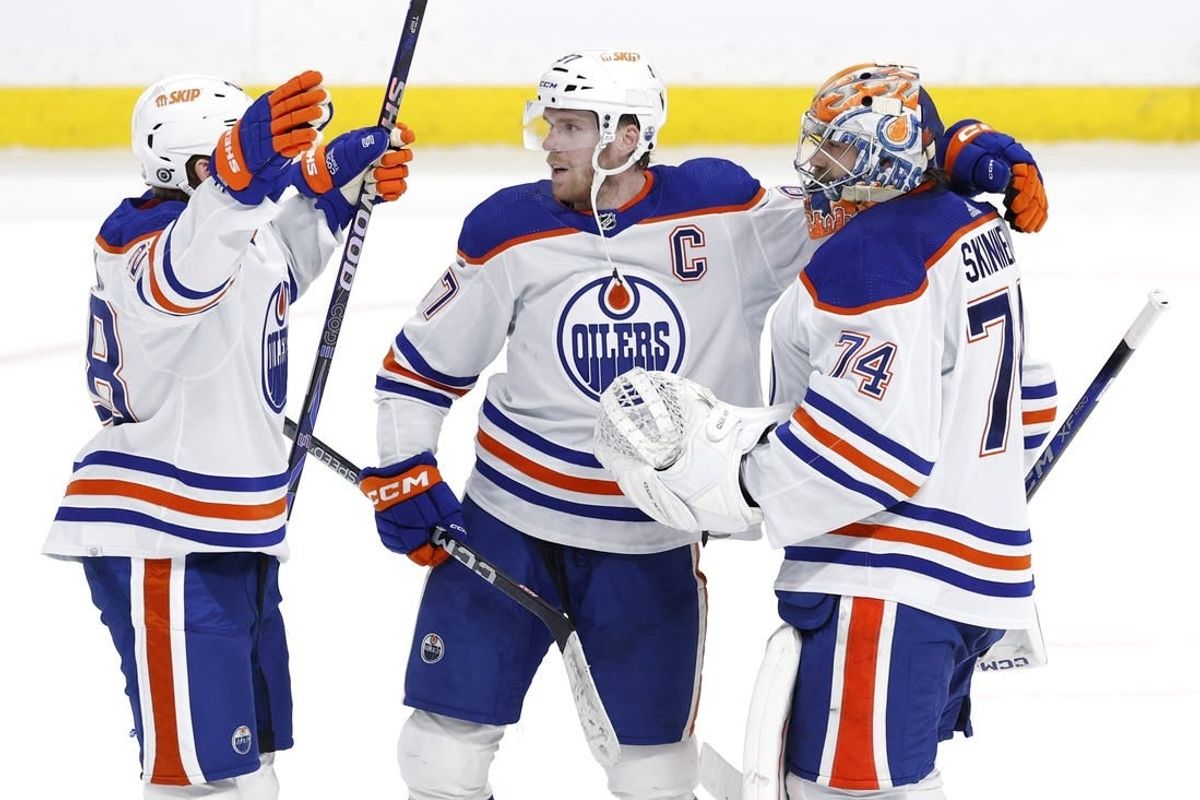 Mar 26, 2024; Winnipeg, Manitoba, CAN; Edmonton Oilers right wing Connor Brown (28), Edmonton Oilers center Connor McDavid (97) and Edmonton Oilers goaltender Stuart Skinner (74) celebrate their overtime victory against the Winnipeg Jets at Canada Life Centre.
