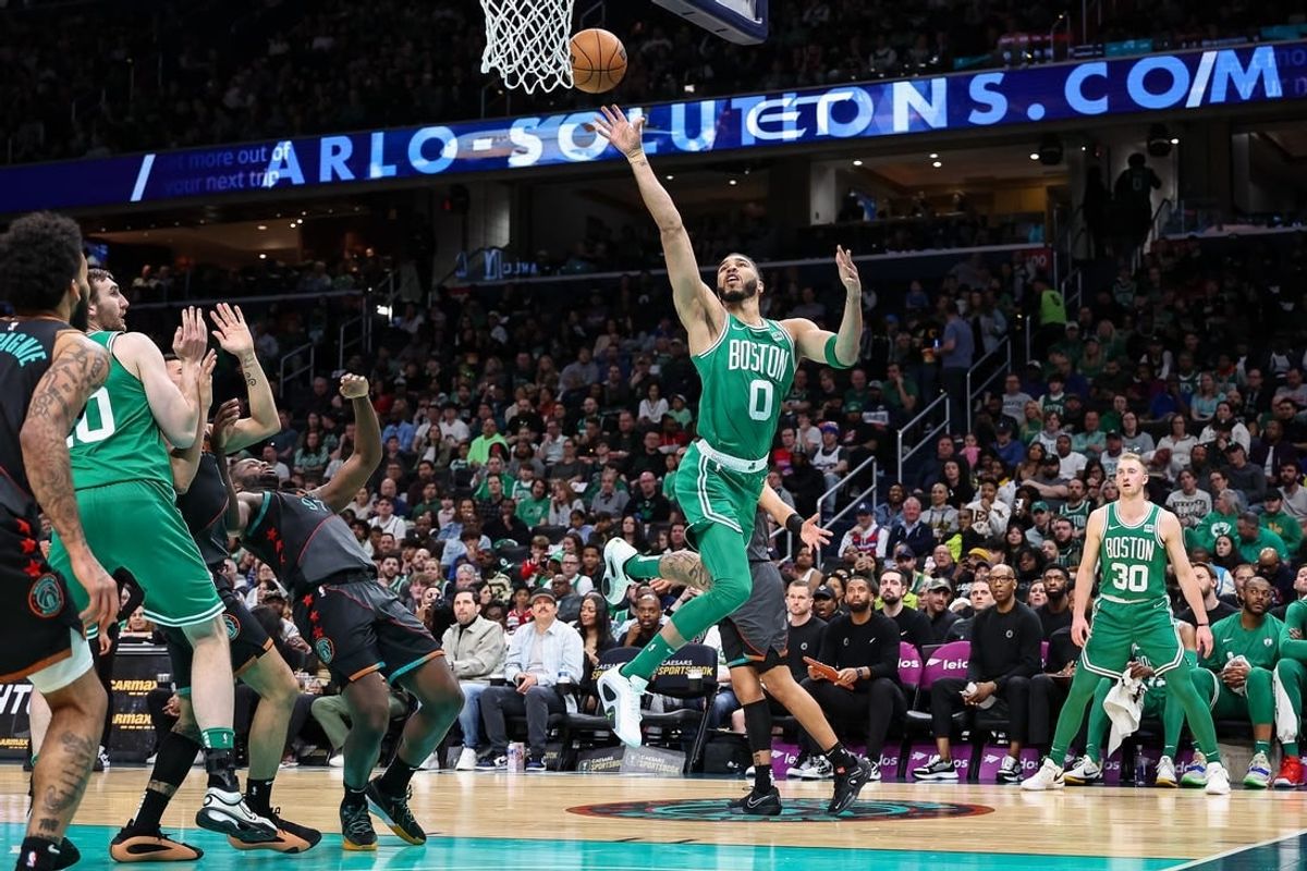 Mar 17, 2024; Washington, District of Columbia, USA; Boston Celtics forward Jayson Tatum (0) goes to the basket against the Washington Wizards during the first half of the game at Capital One Arena.