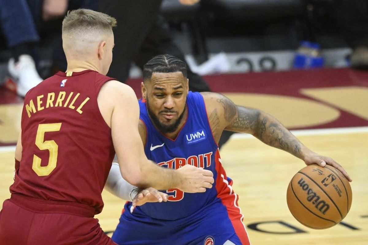 Jan 31, 2024; Cleveland, Ohio, USA; Cleveland Cavaliers guard Sam Merrill (5) defends Detroit Pistons guard Monte Morris (5) in the third quarter at Rocket Mortgage FieldHouse.