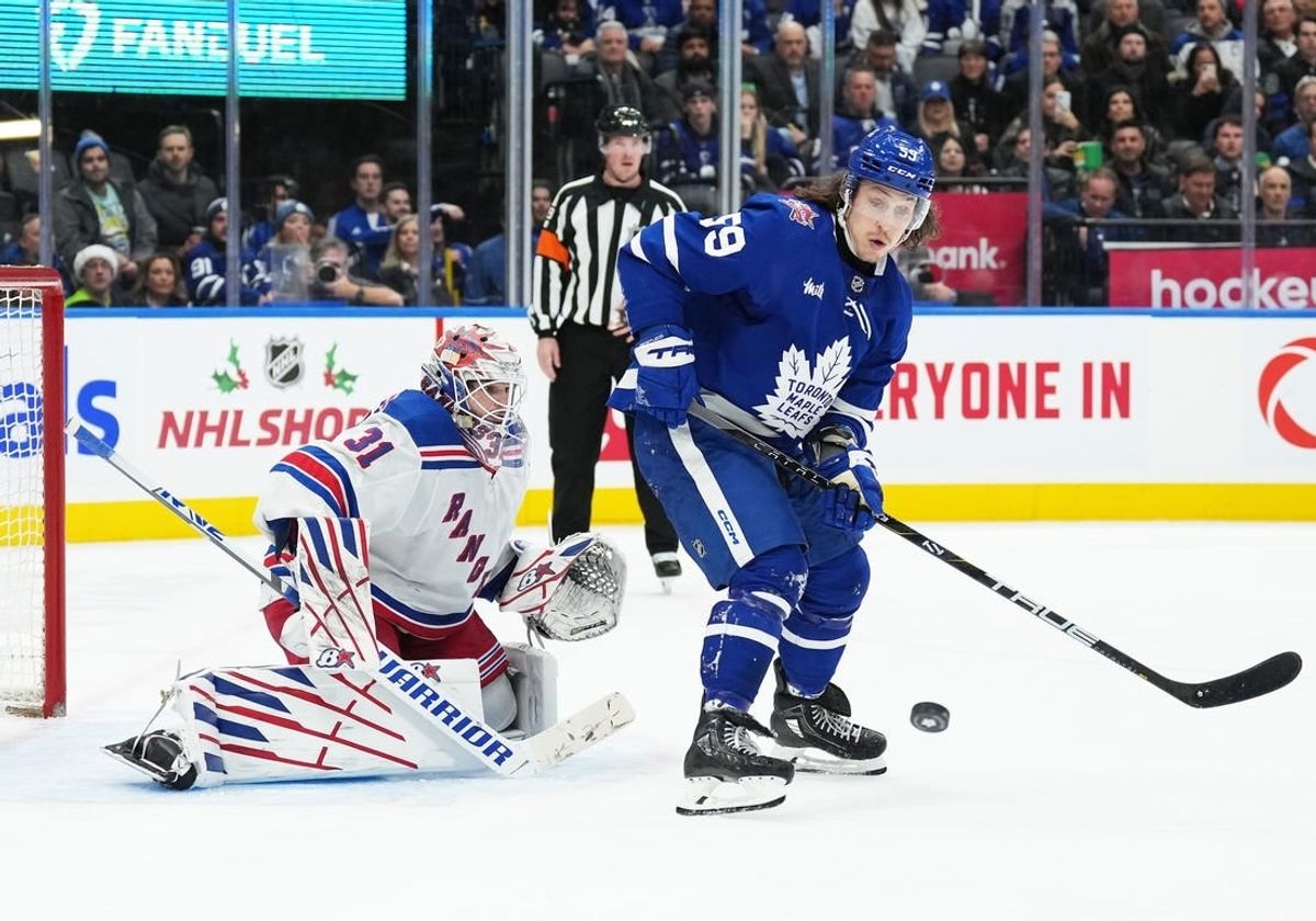 Dec 19, 2023; Toronto, Ontario, CAN; Toronto Maple Leafs left wing Tyler Bertuzzi (59) battles for the puck in front of  New York Rangers goaltender Igor Shesterkin (31) during the third period at Scotiabank Arena.