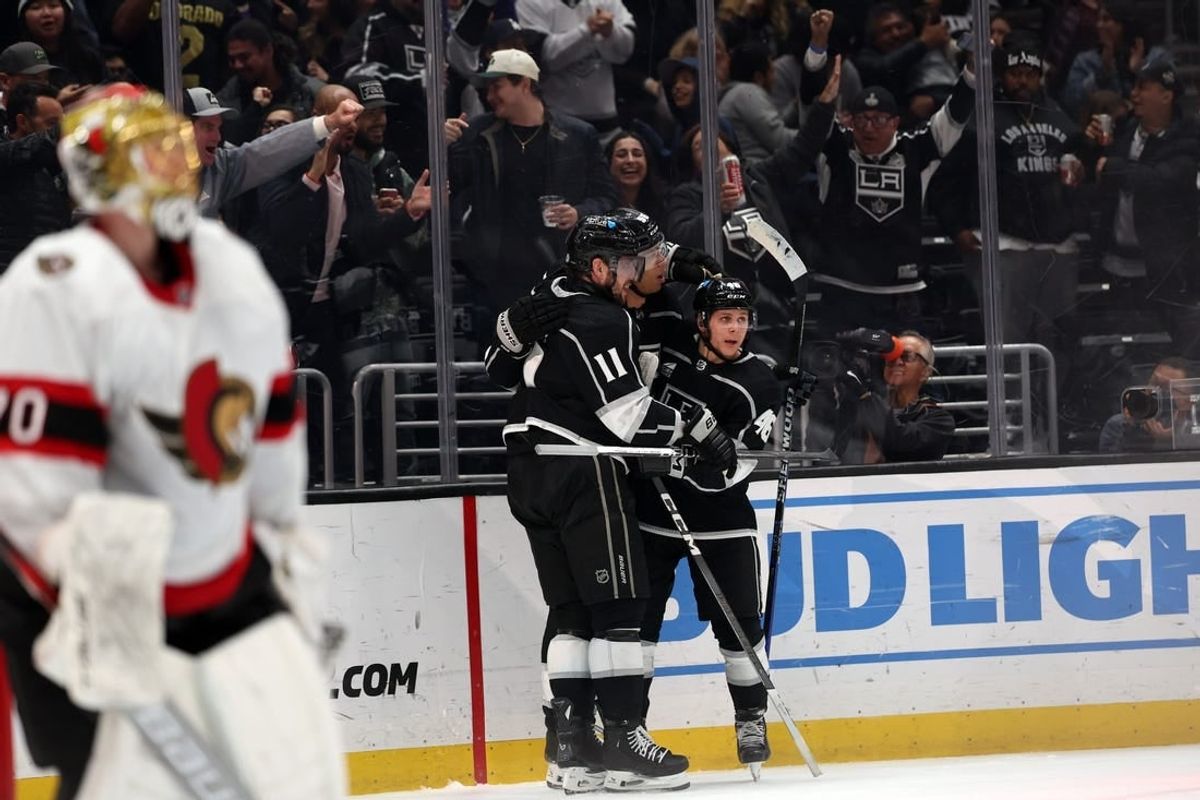 Mar 7, 2024; Los Angeles, California, USA; Los Angeles Kings right wing Quinton Byfield (55, center) celebrates a goal with center Anze Kopitar (11) and center Blake Lizotte (46) during the second period against the Ottawa Senators at Crypto.com Arena.