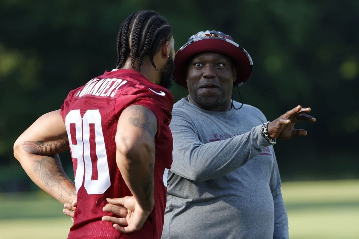 Jun 15, 2022; Ashburn, Virginia, USA; Washington Commanders defensive end Montez Sweat (90) talks with special consultant and NFL Hall of Fame member Warren Sapp (R) on day two of minicamp at The Park.