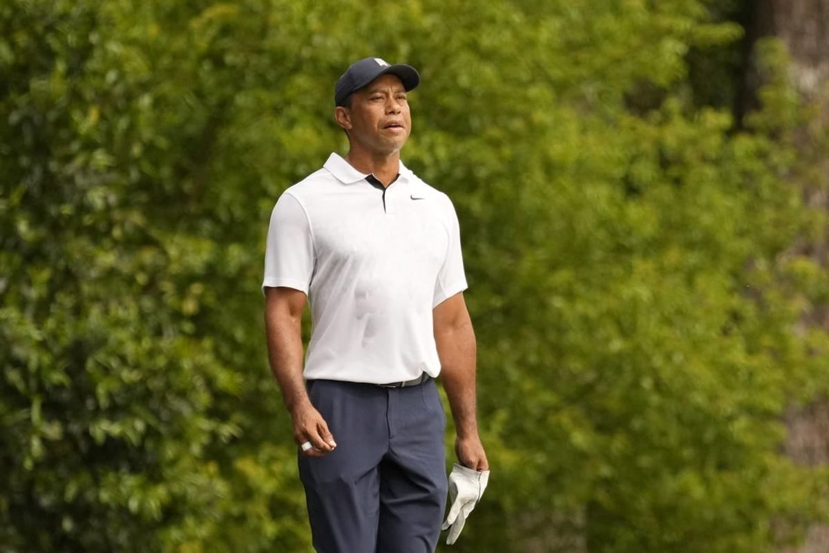 Apr 6, 2023; Augusta, Georgia, USA; Tiger Woods watches his shot on the second fairway during the first round of The Masters golf tournament.