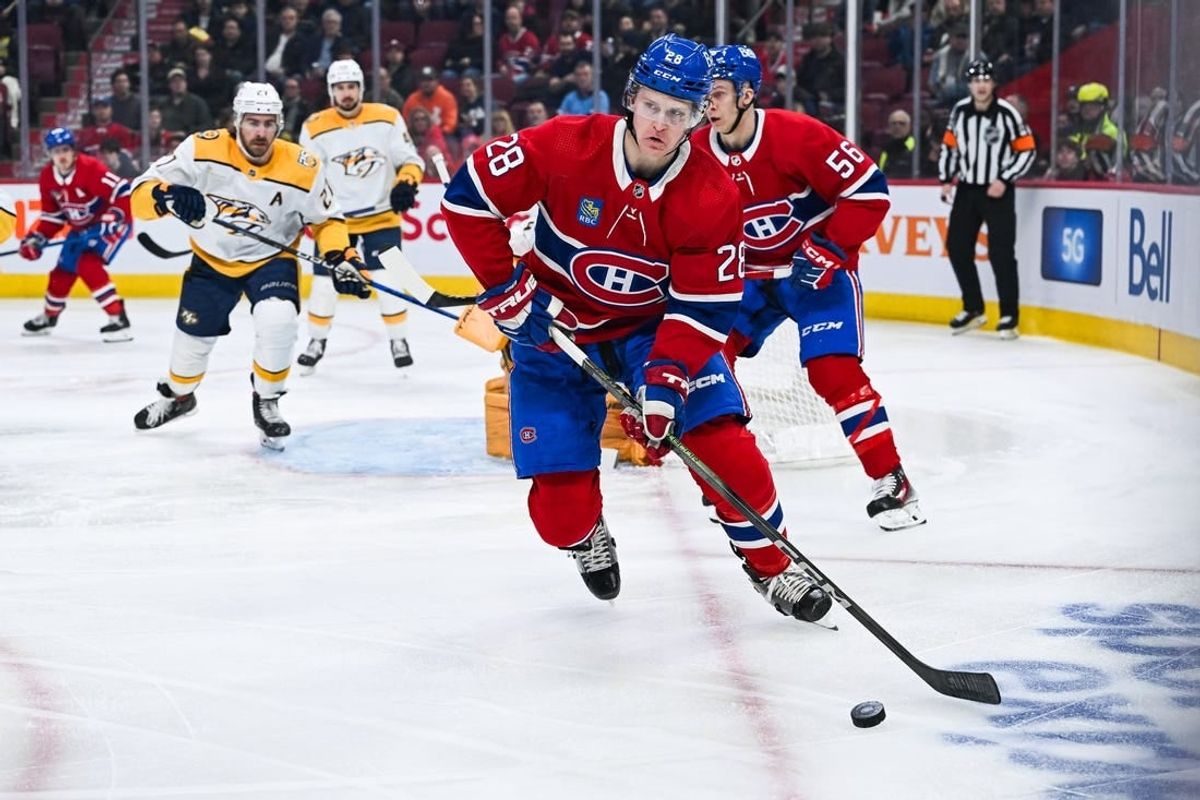 Dec 10, 2023; Montreal, Quebec, CAN; Montreal Canadiens center Christian Dvorak (28) plays the puck against the Nashville Predators during the first period at Bell Centre.