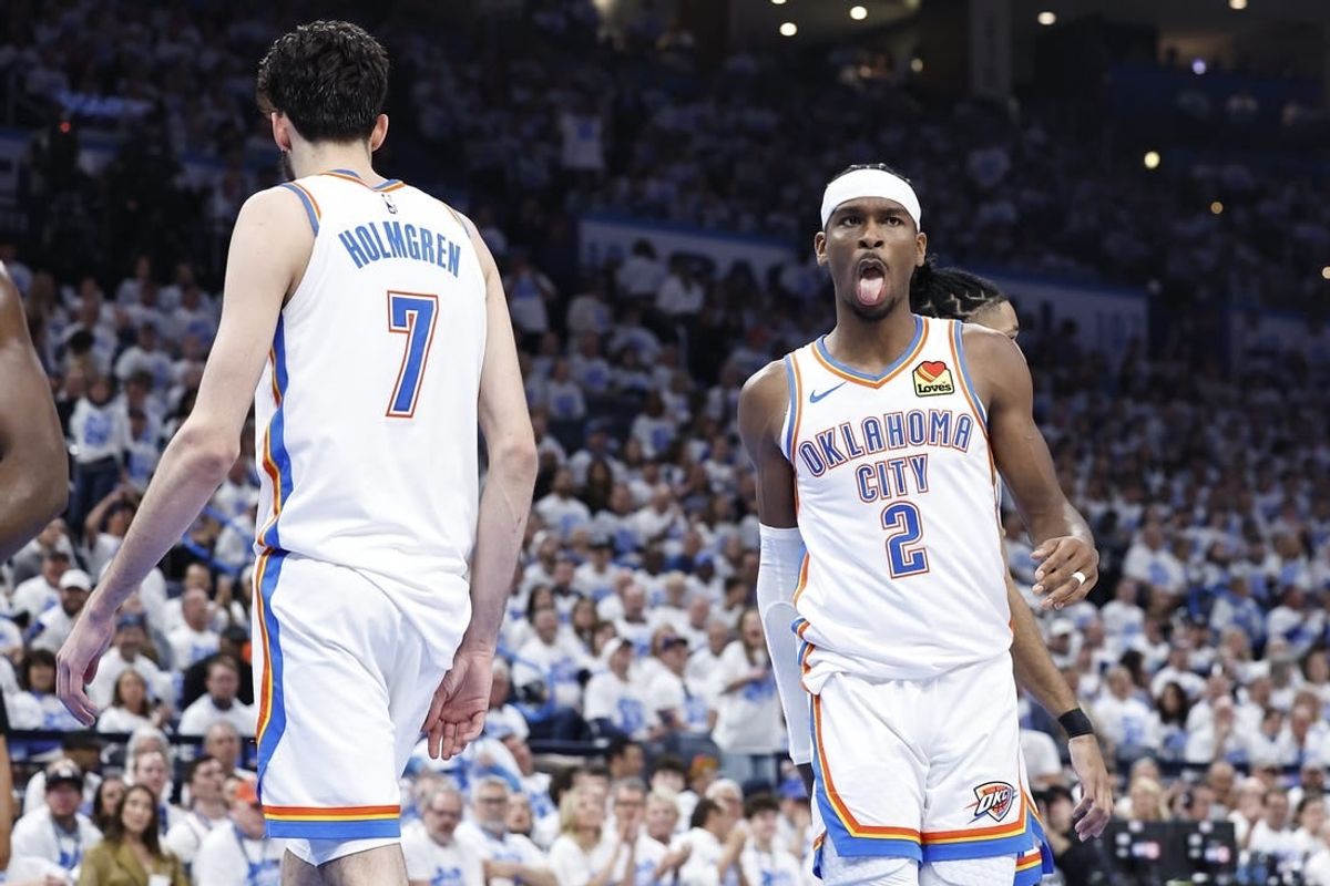 Apr 21, 2024; Oklahoma City, Oklahoma, USA; Oklahoma City Thunder guard Shai Gilgeous-Alexander (2) reacts to forward Chet Holmgren (7) blocking a shot by a New Orleans Pelicans player during the second quarter of game one of the first round for the 2024 NBA playoffs at Paycom Center.