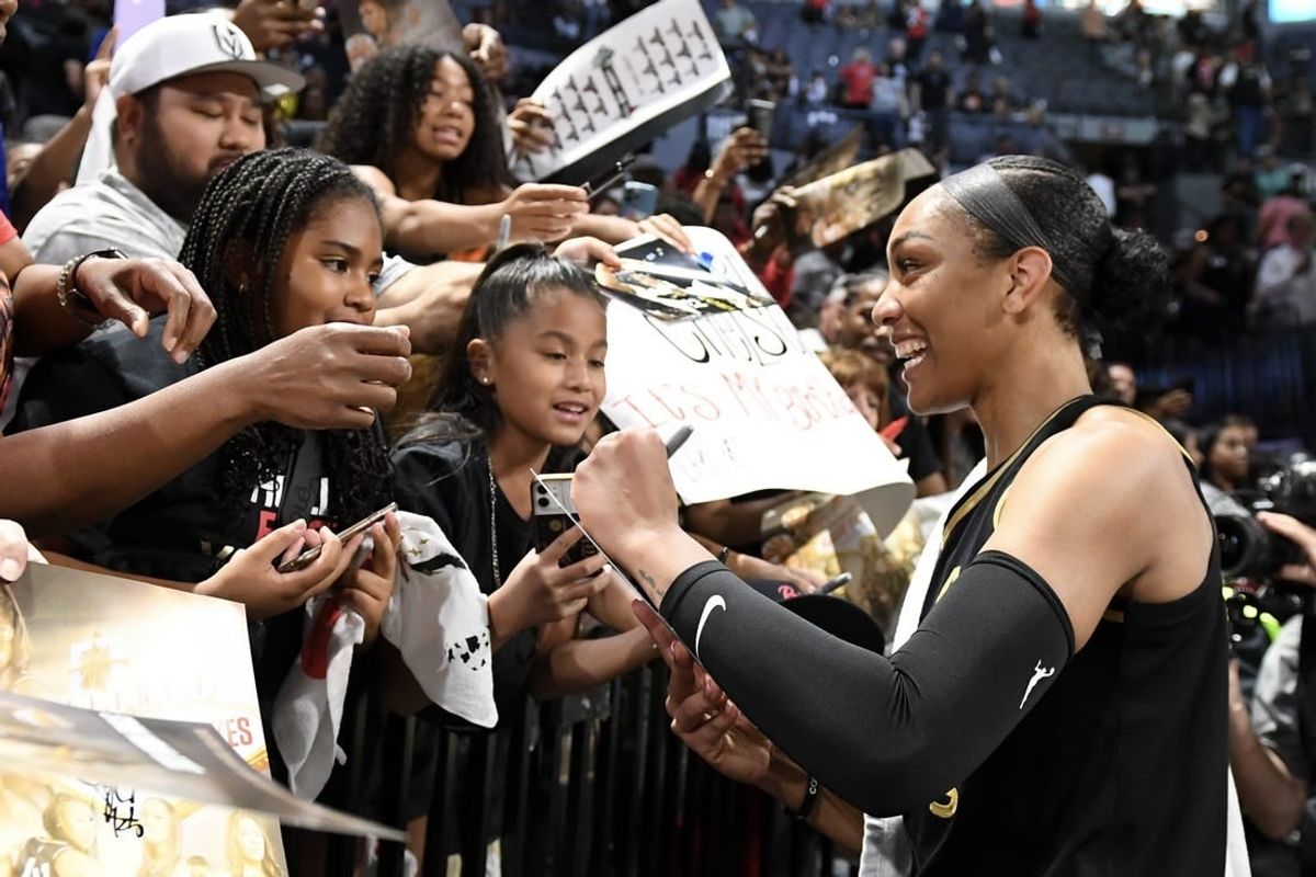 Oct 8, 2023; Las Vegas, Nevada, USA; Las Vegas Aces forward A'ja Wilson (22) signs autographs after game one of the 2023 WNBA Finals against the New York Liberty at Michelob Ultra Arena.