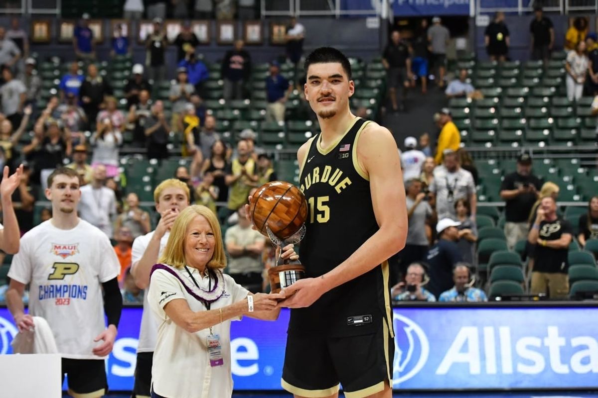 Nov 22, 2023; Honolulu, HI, USA; Purdue Boilermakers center Zach Edey (15) is presented the Most Valuable Player of the tournament by Chaminade University president Lynn Babington at SimpliFi Arena at Stan Sheriff Center.