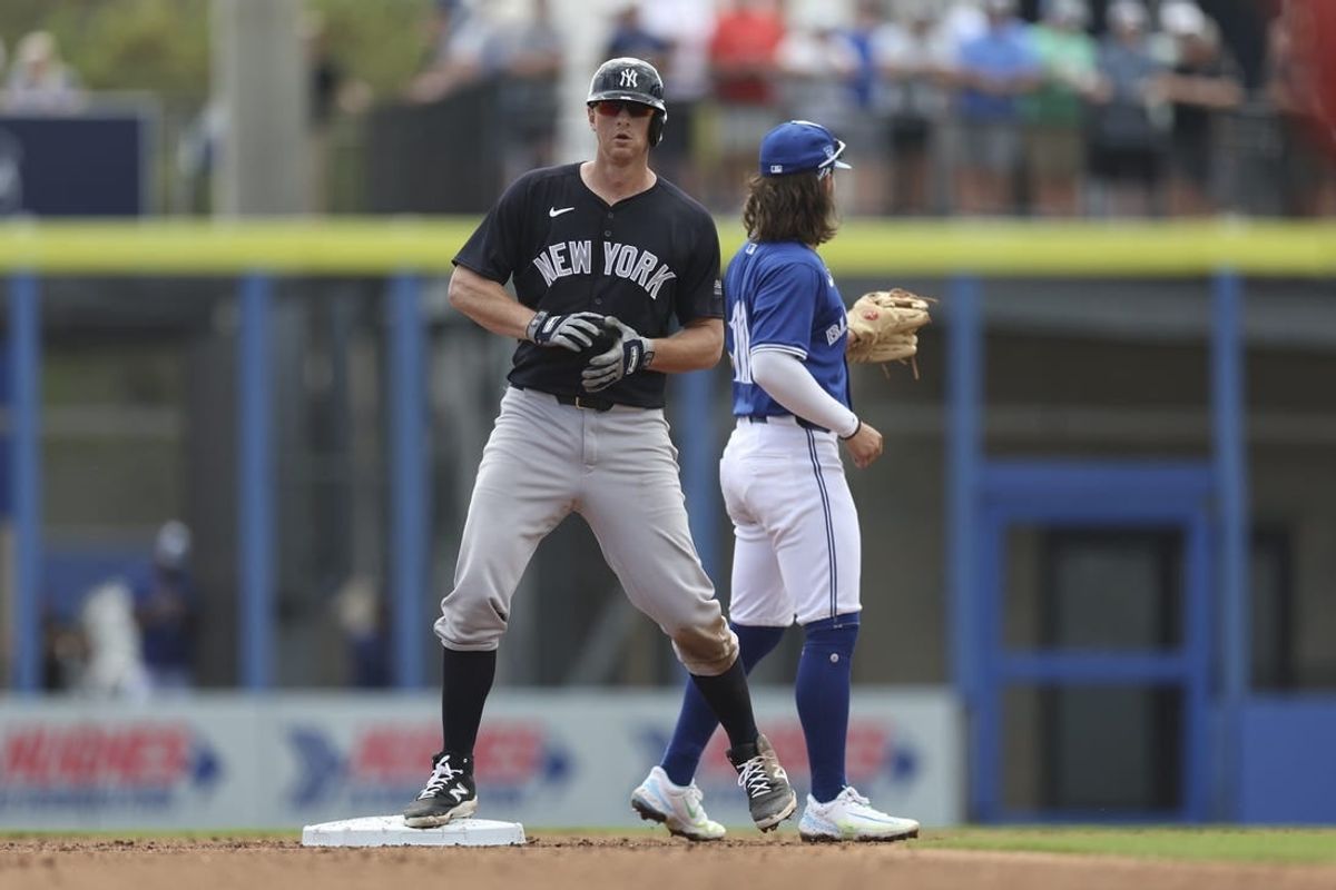 Mar 8, 2024; Dunedin, Florida, USA;  New York Yankees third baseman DJ LeMahieu (26) hits an rbi double against the Toronto Blue Jays in the third inning at TD Ballpark.