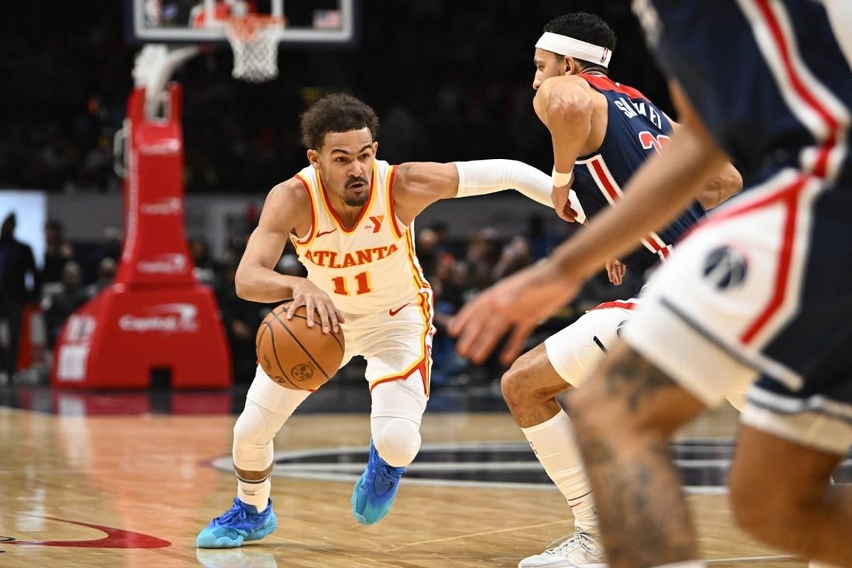 Nov 25, 2023; Washington, District of Columbia, USA; Atlanta Hawks guard Trae Young (11) dribbles against the Washington Wizards during the first half at Capital One Arena.