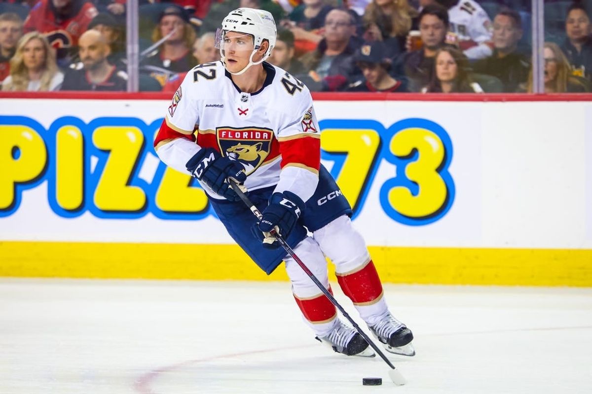 Dec 18, 2023; Calgary, Alberta, CAN; Florida Panthers defenseman Gustav Forsling (42) skates with the puck against the Calgary Flames during the third period at Scotiabank Saddledome.