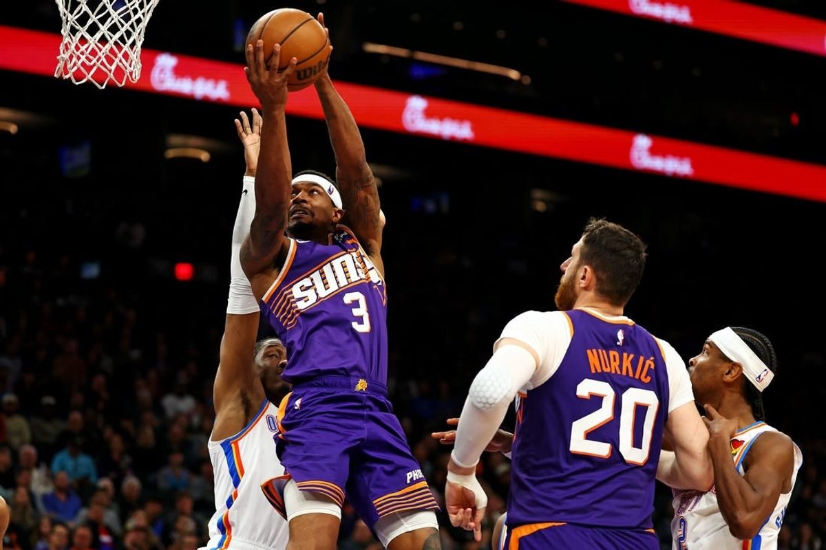 Mar 3, 2024; Phoenix, Arizona, USA; Phoenix Suns guard Bradley Beal (3) shoots the ball against Oklahoma City Thunder guard Shai Gilgeous-Alexander (2) at Footprint Center.