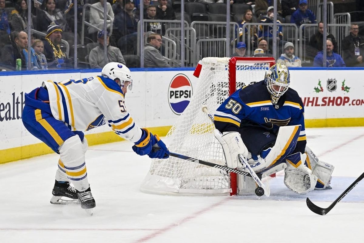 Nov 30, 2023; St. Louis, Missouri, USA;  St. Louis Blues goaltender Jordan Binnington (50) defends the net against Buffalo Sabres left wing Jeff Skinner (53) during the third period at Enterprise Center.
