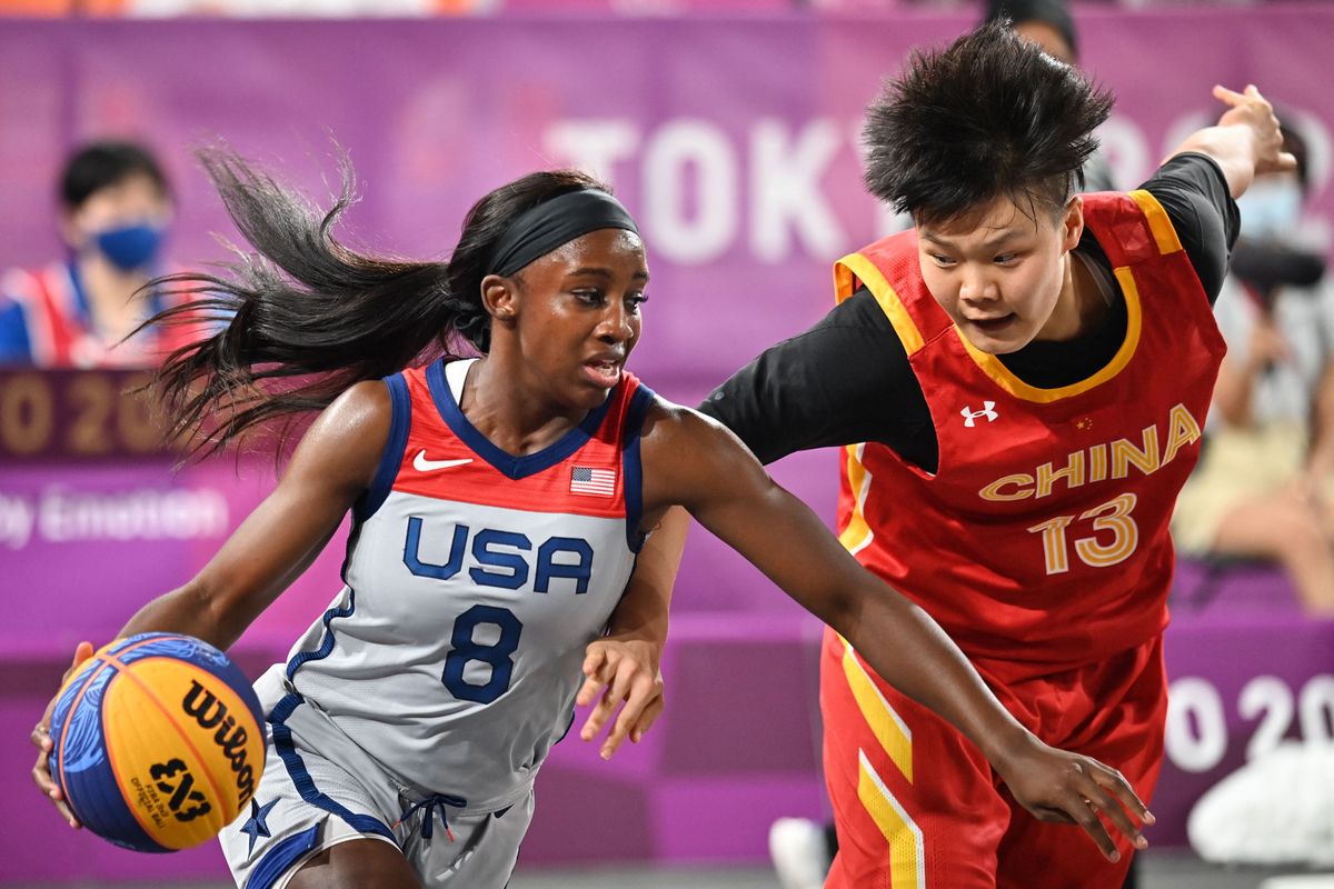 USA’s  Jacquelyn  Young  (l.)  fights  for  the  ball  with  China’s  Wan  Jiyuan  during  the  women’s  pool  round  3x3  basketball  match  between  USA  and  China  at  the  Aomi  Urban  Sports  Park  in  Tokyo,  on  July  26,  2021.
