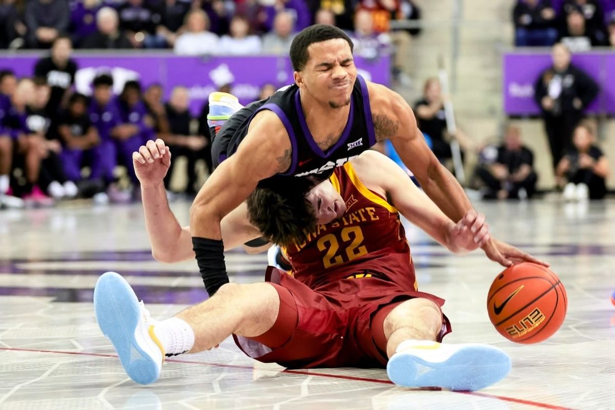 Jan 20, 2024; Fort Worth, Texas, USA;  TCU Horned Frogs guard Jameer Nelson Jr. (4) and Iowa State Cyclones forward Milan Momcilovic (22) go for a loose ball during the second half at Ed and Rae Schollmaier Arena.