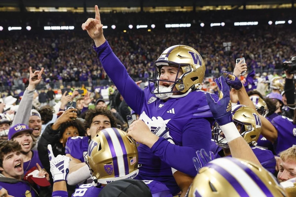 Nov 25, 2023; Seattle, Washington, USA; Washington Huskies place kicker Grady Gross (95) celebrates after making a game-winning field goal against the Washington State Cougars during the fourth quarter at Alaska Airlines Field at Husky Stadium.