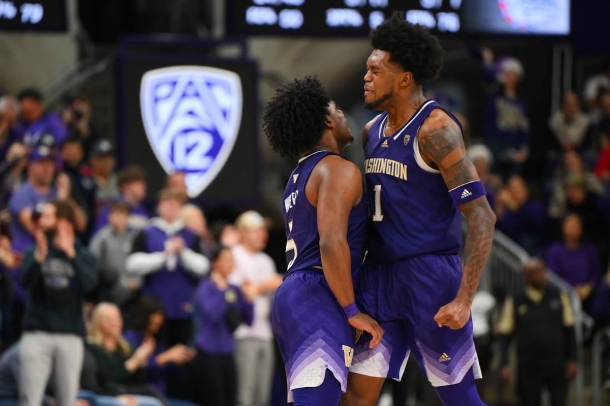 Dec 9, 2023; Seattle, Washington, USA; Washington Huskies guard Sahvir Wheeler (5) and forward Keion Brooks Jr. (1) celebrate after a scored against the Gonzaga Bulldogs during the second half at Alaska Airlines Arena at Hec Edmundson Pavilion.
