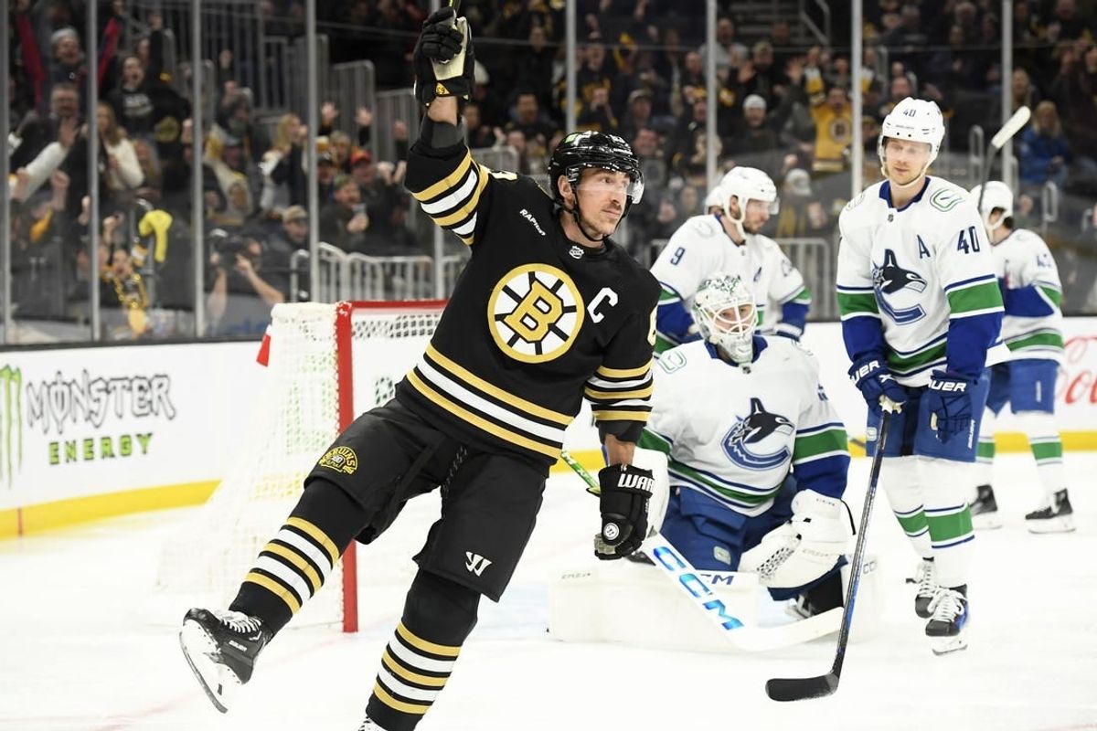 Feb 8, 2024; Boston, Massachusetts, USA; Boston Bruins left wing Brad Marchand (63) reacts after scoring a goal during the first period against the Vancouver Canucks at TD Garden.