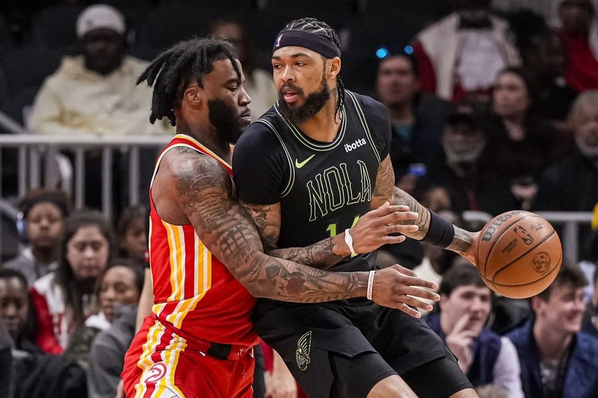 Mar 10, 2024; Atlanta, Georgia, USA; New Orleans Pelicans forward Brandon Ingram (14) dribbles guarded by Atlanta Hawks forward Saddiq Bey (41) during the first half at State Farm Arena.