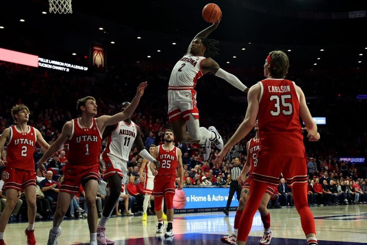 Jan 6, 2024; Tucson, Arizona, USA; Arizona Wildcats guard Caleb Love (2) makes a basket against Utah Utes forward Ben Carlson (1) during the second half at McKale Center.