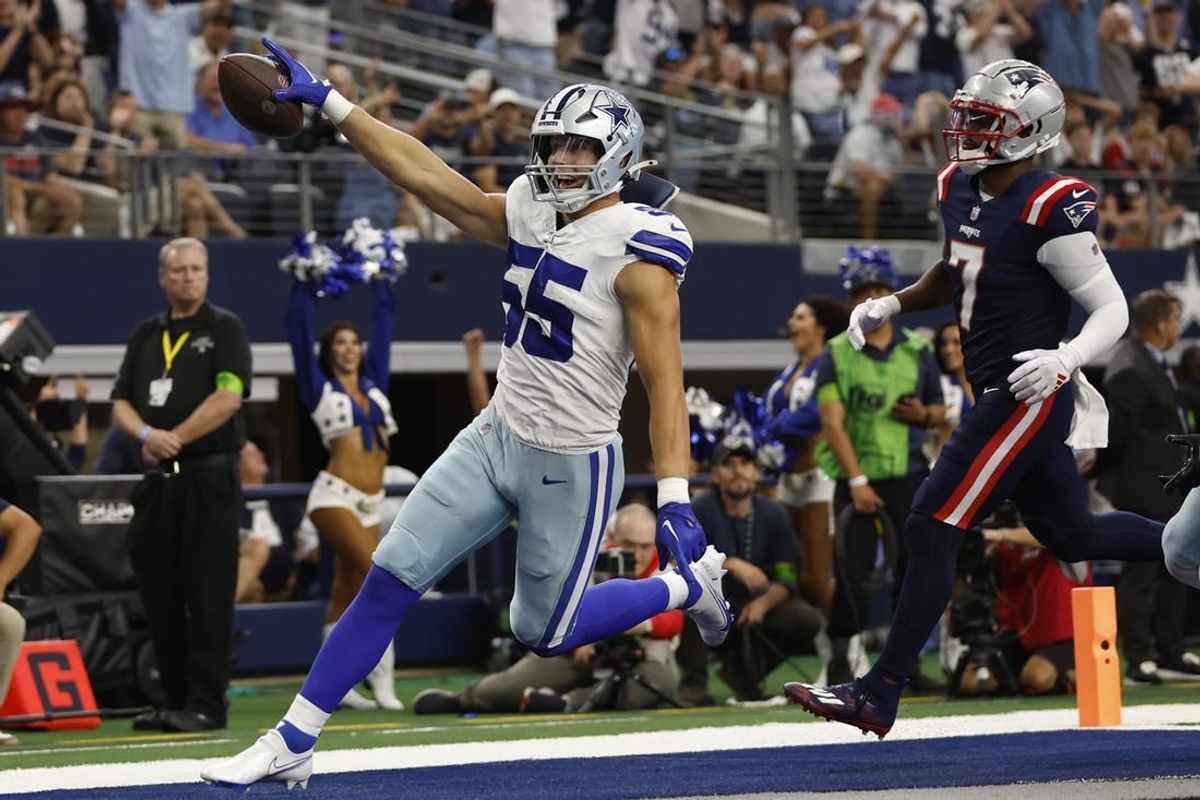 Oct 1, 2023; Arlington, Texas, USA; Dallas Cowboys linebacker Leighton Vander Esch (55) returns a fumble for a touchdown in the second quarter against the New England Patriots at AT&T Stadium.