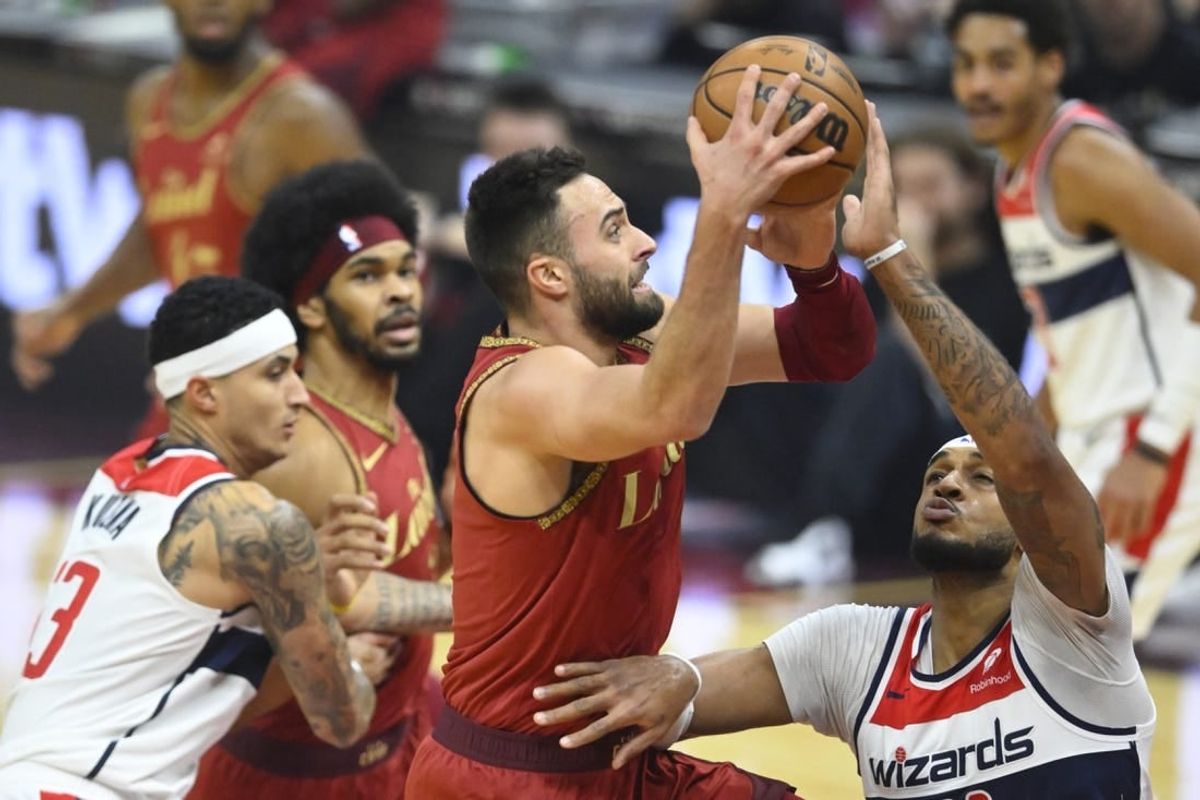 Jan 3, 2024; Cleveland, Ohio, USA; Cleveland Cavaliers guard Max Strus (1) drives against Washington Wizards center Daniel Gafford (21) in the first quarter at Rocket Mortgage FieldHouse.
