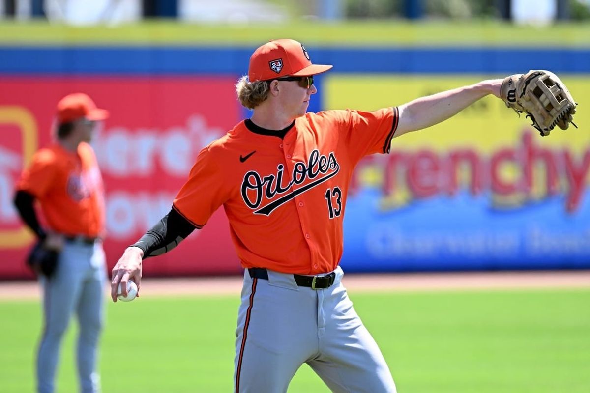 Mar 19, 2024; Dunedin, Florida, USA; Baltimore Orioles right fielder Heston Kjerstad (13) warms up before the start of the spring training game against the Toronto Blue Jays  at TD Ballpark.