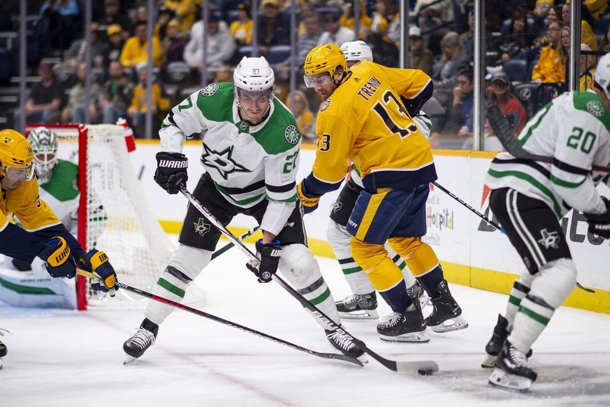 Feb 15, 2024; Nashville, Tennessee, USA; Dallas Stars left wing Mason Marchment (27) skates with the puck  against the Nashville Predators during the first period at Bridgestone Arena.