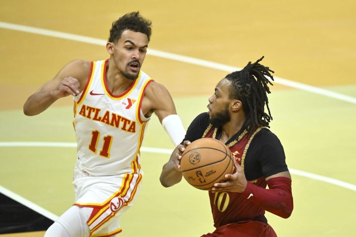 Nov 28, 2023; Cleveland, Ohio, USA; Atlanta Hawks guard Trae Young (11) defends Cleveland Cavaliers guard Darius Garland (10) in the fourth quarter at Rocket Mortgage FieldHouse.