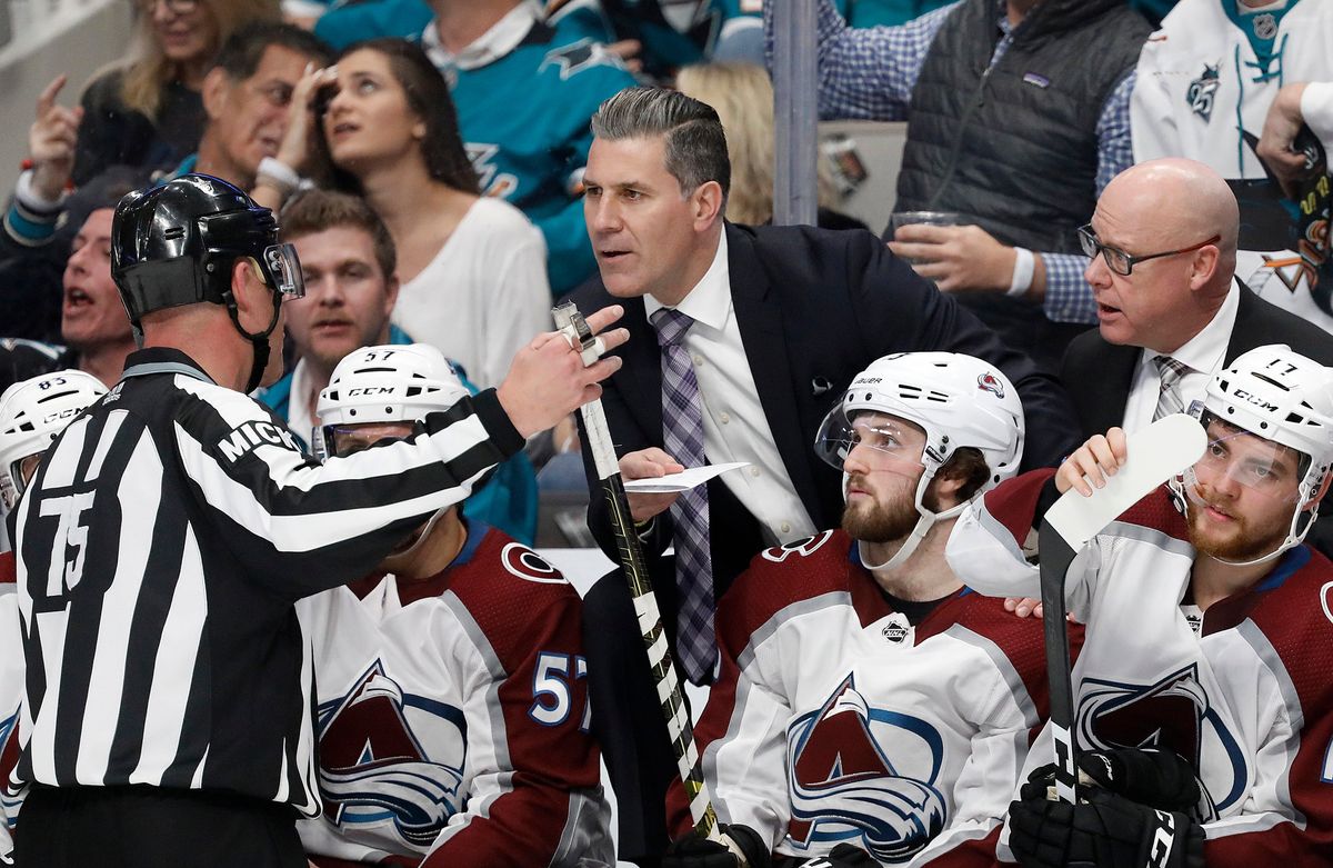 That iconic NHL image: A ref explaining an offside call spotted only on video review.