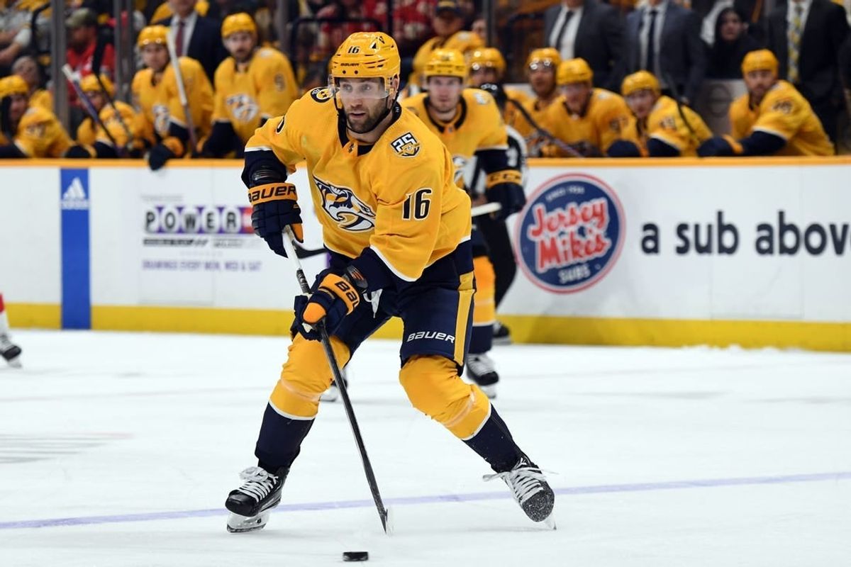 Mar 23, 2024; Nashville, Tennessee, USA; Nashville Predators left wing Jason Zucker (16) skates the puck into the offensive zone during the third period against the Detroit Red Wings at Bridgestone Arena.