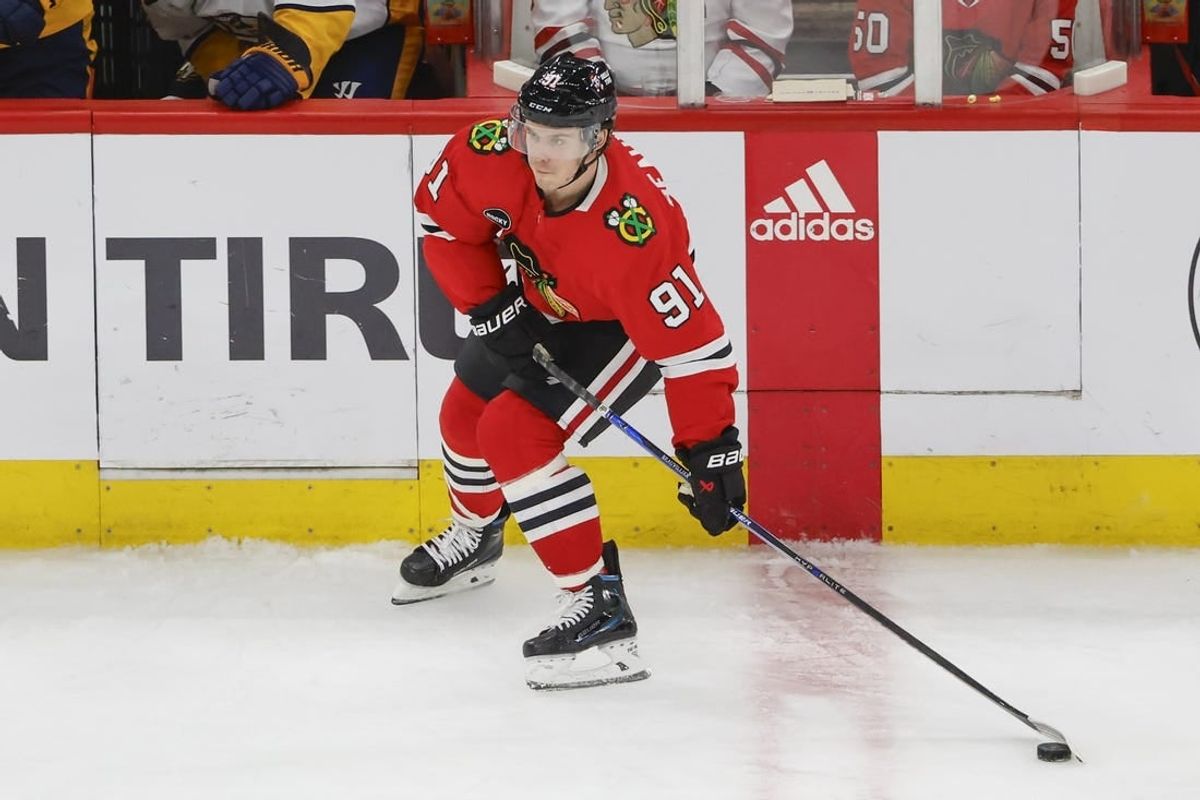 Dec 5, 2023; Chicago, Illinois, USA; Chicago Blackhawks left wing Anthony Beauvillier (91) looks to pass the puck against the Nashville Predators during the third period at United Center.