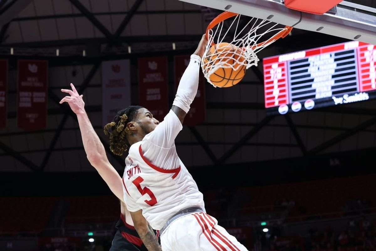 Feb 29, 2024; Salt Lake City, Utah, USA; Utah Utes guard Deivon Smith (5) dunks the ball against the Stanford Cardinal during the second half at Jon M. Huntsman Center.