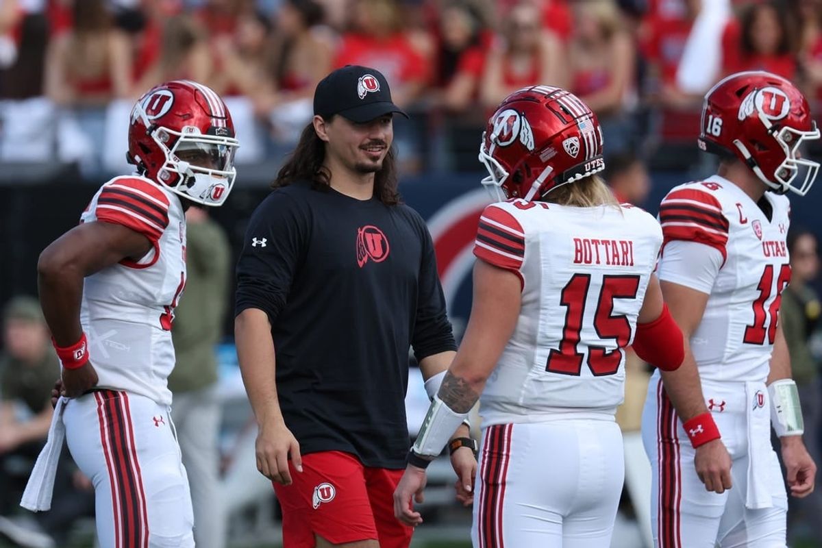 Nov 18, 2023; Tucson, Arizona, USA; Utah Utes quarterback Cameron Rising (middle) on the field during warms ups with quarterback Bryson Barnes (16), quarterback Nate Johnson (13) and quarterback Luke Bottari (15) at Arizona Stadium.