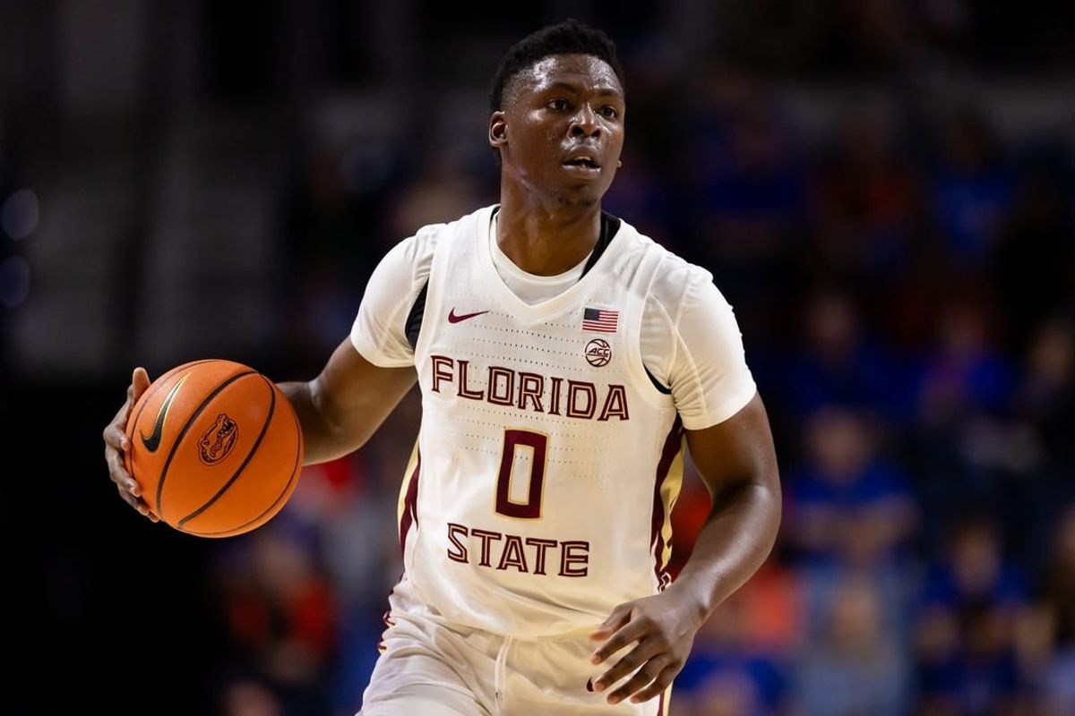 Nov 17, 2023; Gainesville, Florida, USA; Florida State Seminoles guard Chandler Jackson (0) dribbles the ball during the first half against the Florida Gators at Exactech Arena at the Stephen C. O'Connell Center.