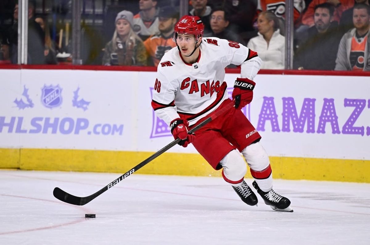 Nov 28, 2023; Philadelphia, Pennsylvania, USA; Carolina Hurricanes center Martin Necas (88) controls the puck against the Philadelphia Flyers in the second period at Wells Fargo Center.