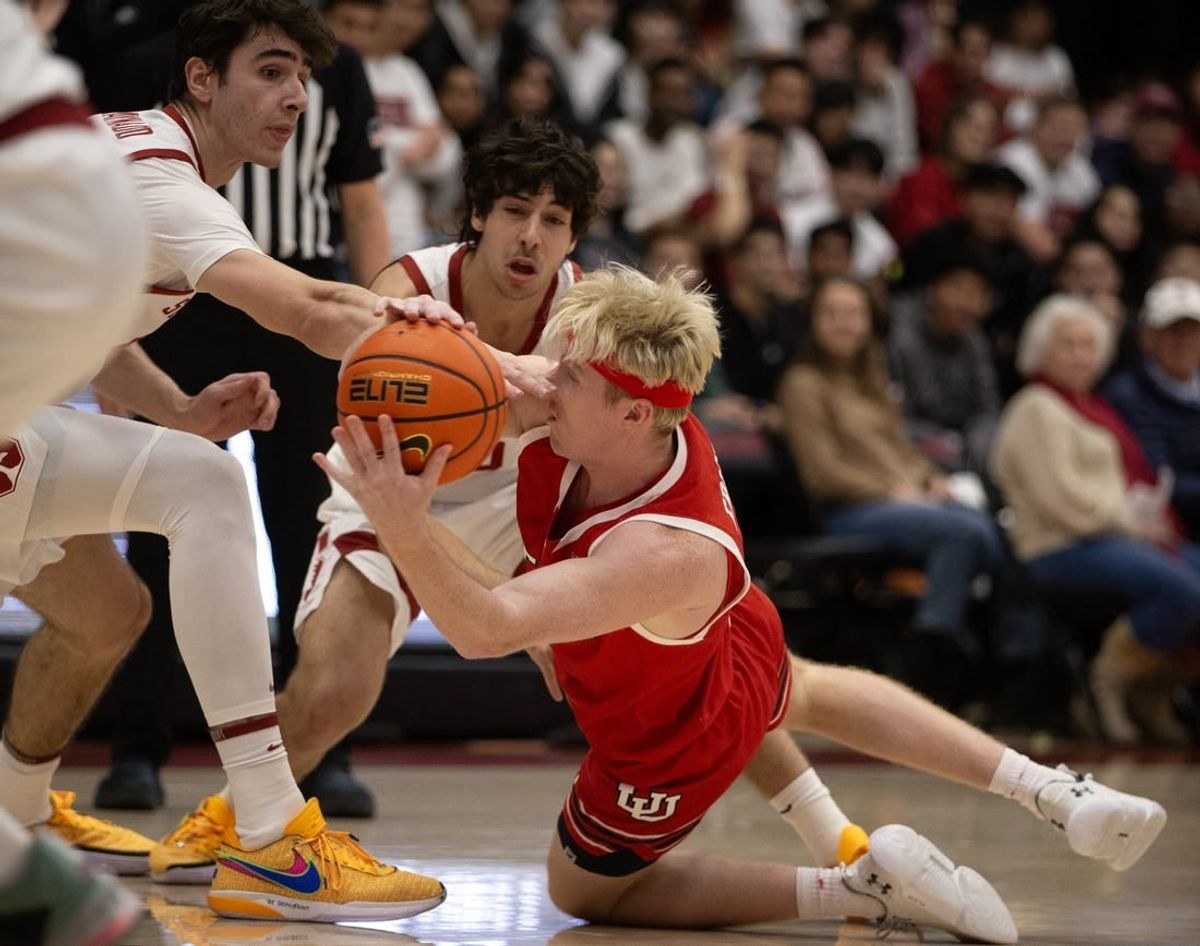 Jan 14, 2024; Stanford, California, USA; Utah Utes guard Hunter Erickson (right) competes for a loose ball with Stanford Cardinal forward Maxime Raynaud (left) and guard Benny Gealer during the first half at Maples Pavilion.