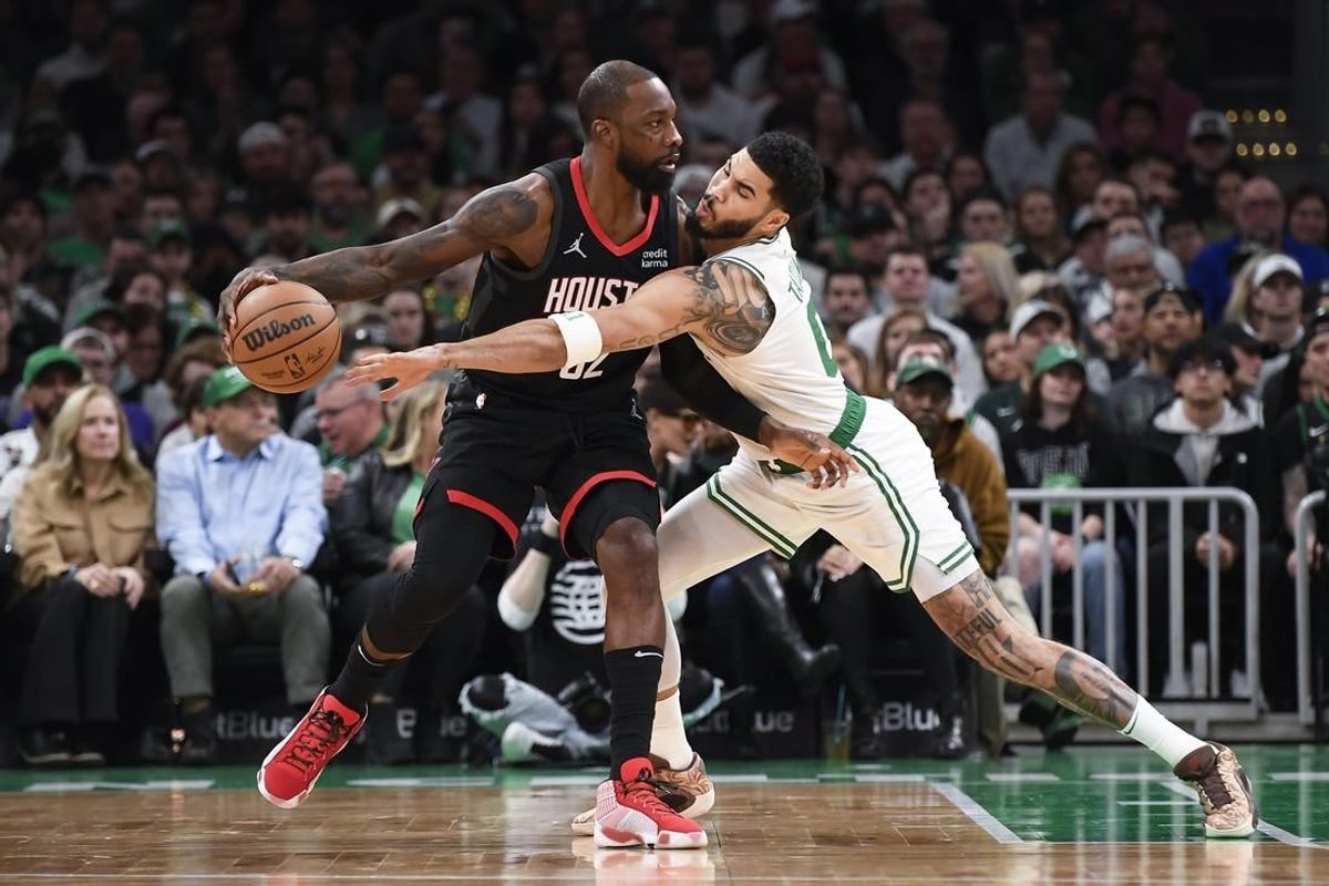 Jan 13, 2024; Boston, Massachusetts, USA;  Houston Rockets forward Jeff Green (32) controls the ball away from Boston Celtics forward Jayson Tatum (0) during the first half at TD Garden.
