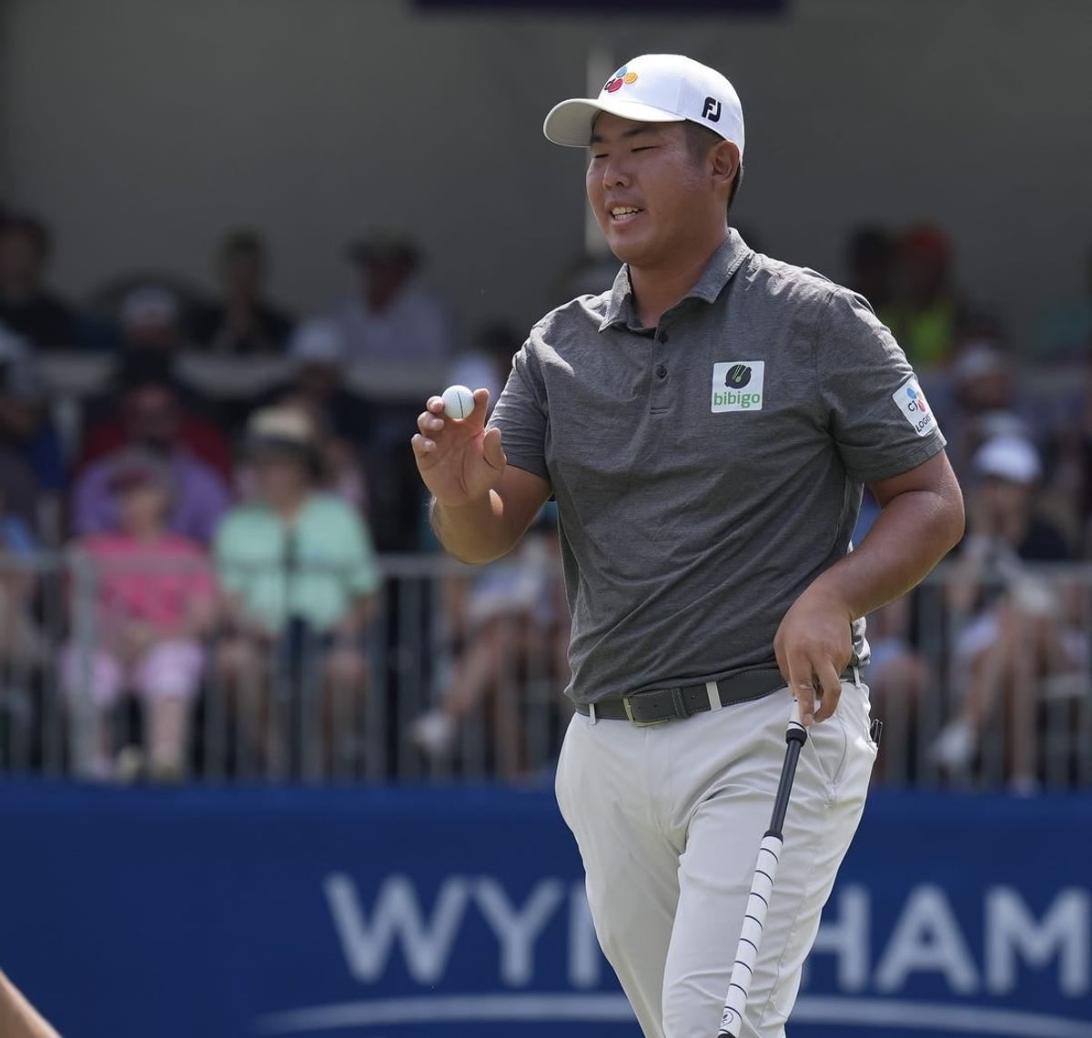 Aug 6, 2023; Greensboro, North Carolina, USA; Byeong Hun An shows the ball after a birdie on the 9th green during the final round of the Wyndham Championship golf tournament.