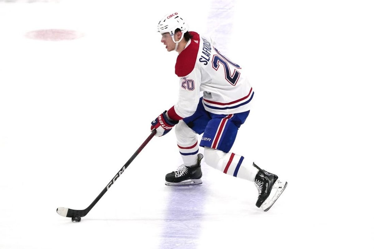 Dec 30, 2023; Sunrise, Florida, USA;  Montreal Canadiens left wing Juraj Slafkovsky (20) brings the puck up the ice against the Florida Panthers during the second period at Amerant Bank Arena.