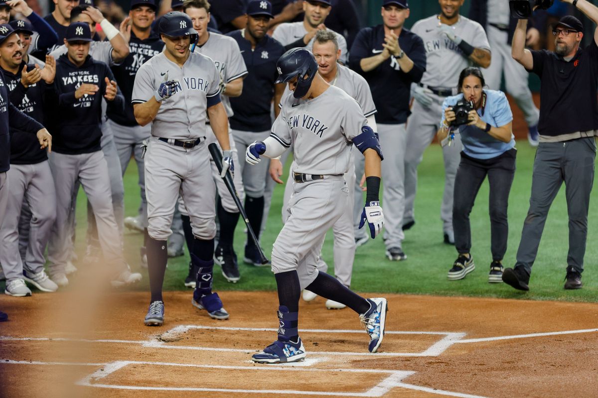 Aaron Judge touches home plate after hitting his 62nd home run of the 2022 season