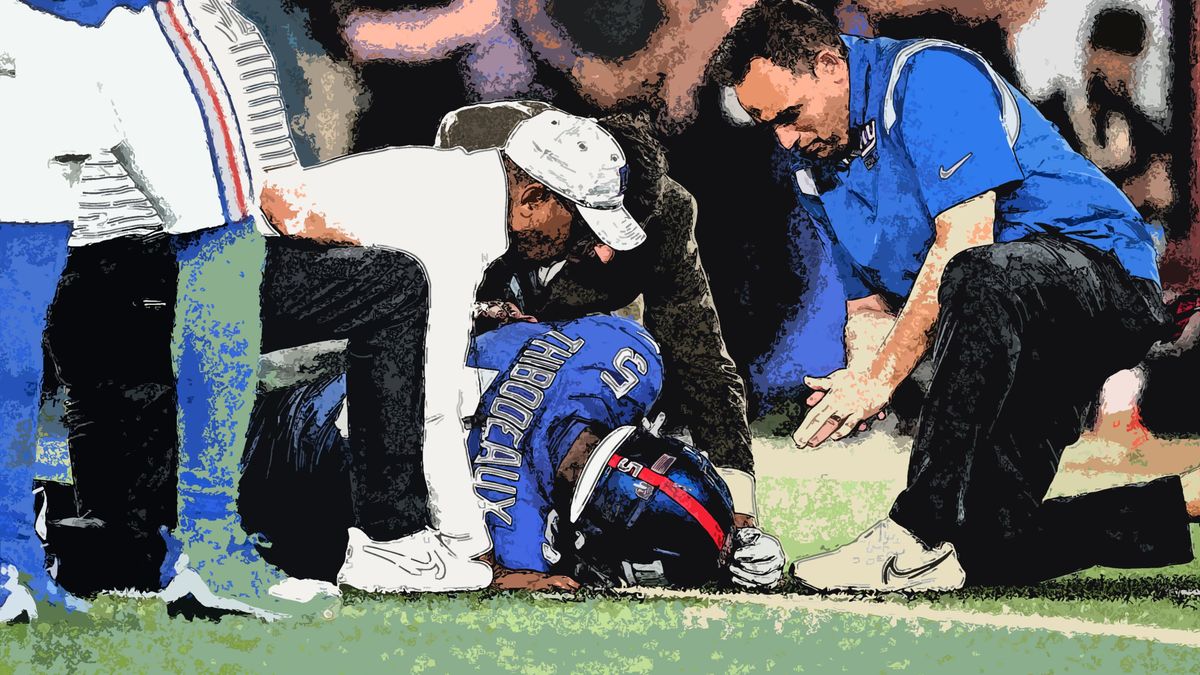 Team trainers attend to the Giants’ Kayvon Thibodeaux after an injury during the first half of a preseason game against the Cincinnati Bengals at MetLife Stadium.