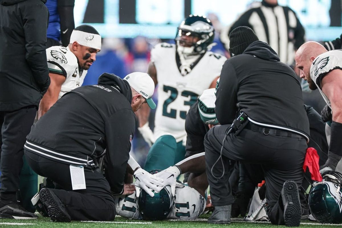 Jan 7, 2024; East Rutherford, New Jersey, USA; Philadelphia Eagles wide receiver A.J. Brown (11) reacts after an injury against the New York Giants during the first quarter at MetLife Stadium.